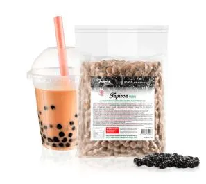 Black tapioca pearls in transparent packaging bag with loose pearls displayed